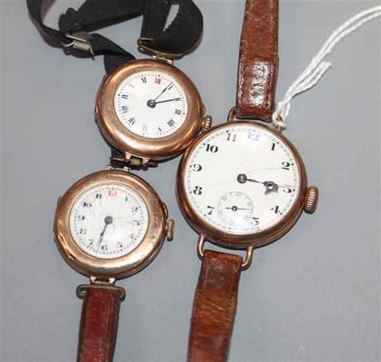 A 9ct gold trench watch and two similar smaller watches